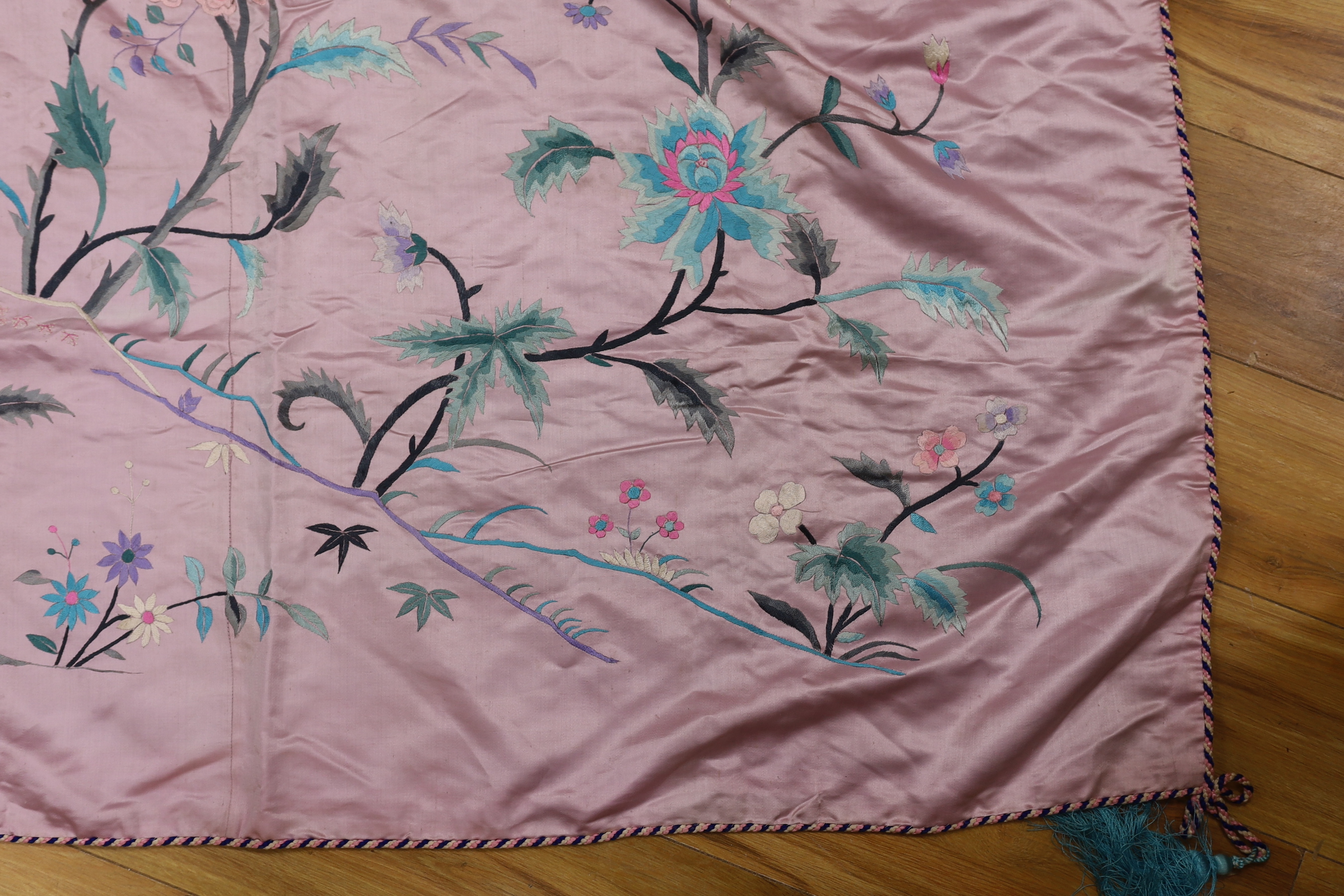 An Oriental mauve ground embroidered silk shawl